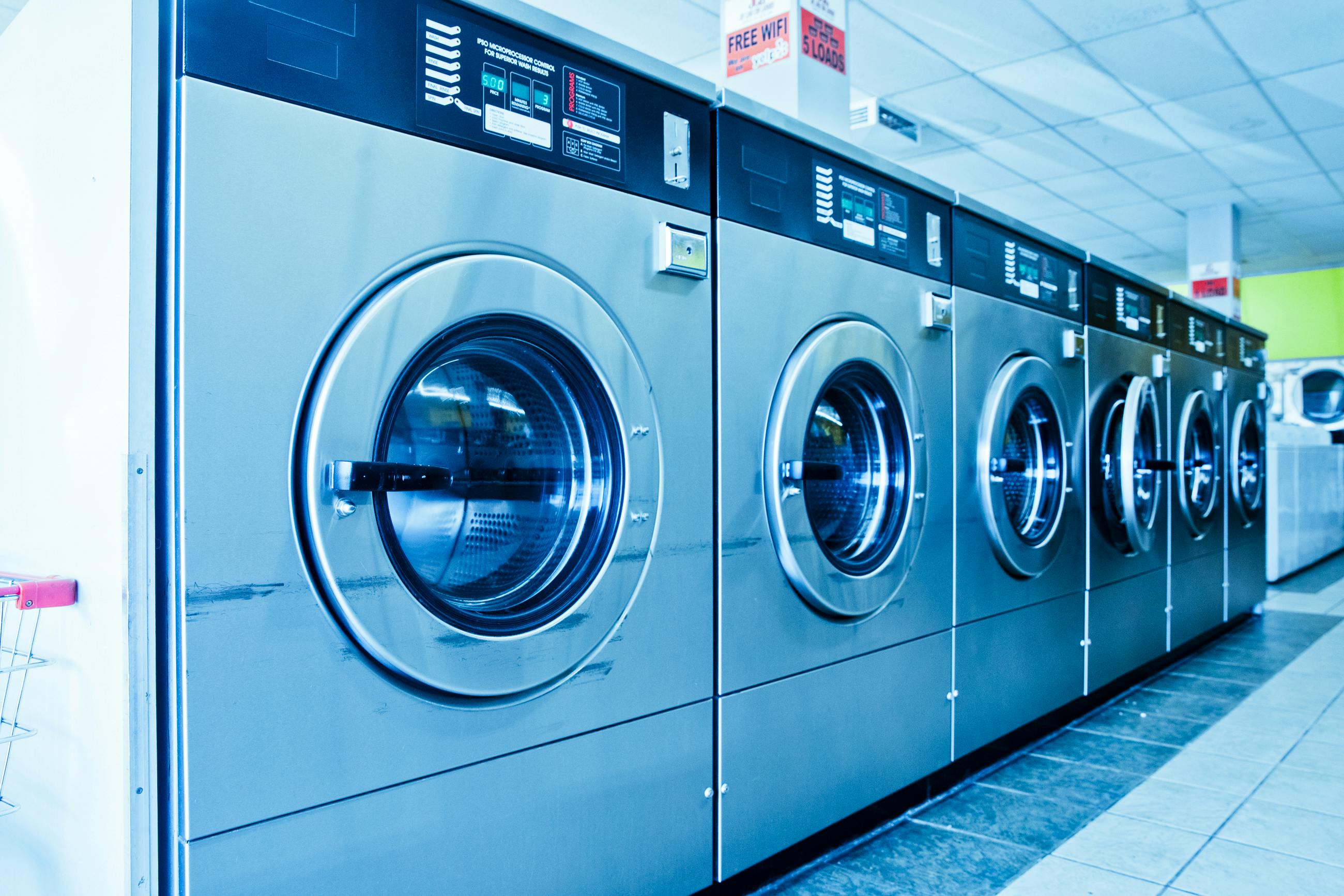 Laundry machines lined up for service